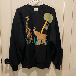Kozy Swets Sweatshirt.  Black with Animal Scene.  Size Large.  Pit to pit is 22”